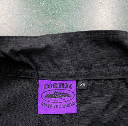 Calça Corteiz Guerillaz Cargo Black/Purple